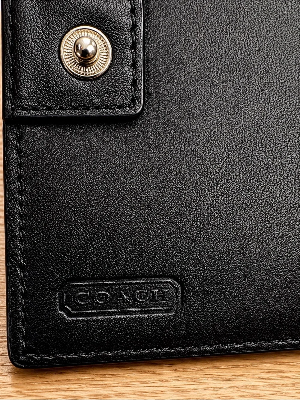 Coach Black Leather Compact Wallet with Embossed Logo